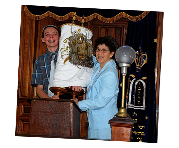 Suri officiating the Bar Mitzvah of a young man